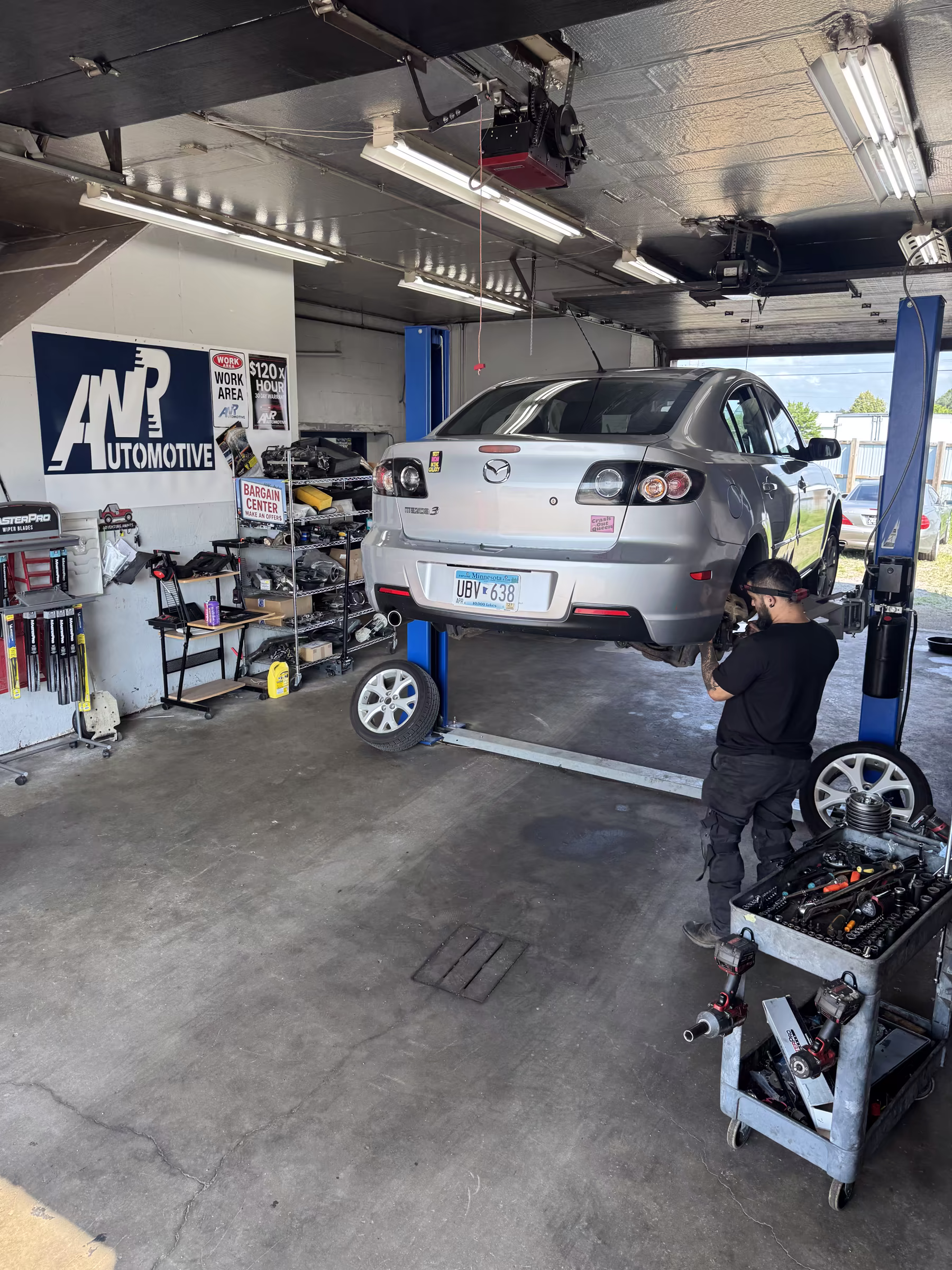 ANR Automotive technician servicing a vehicle in the shop